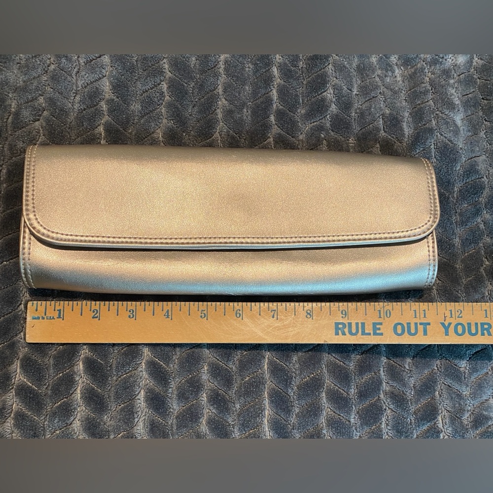 Gap clutch rose gold good used condition. Normal wear please see pics